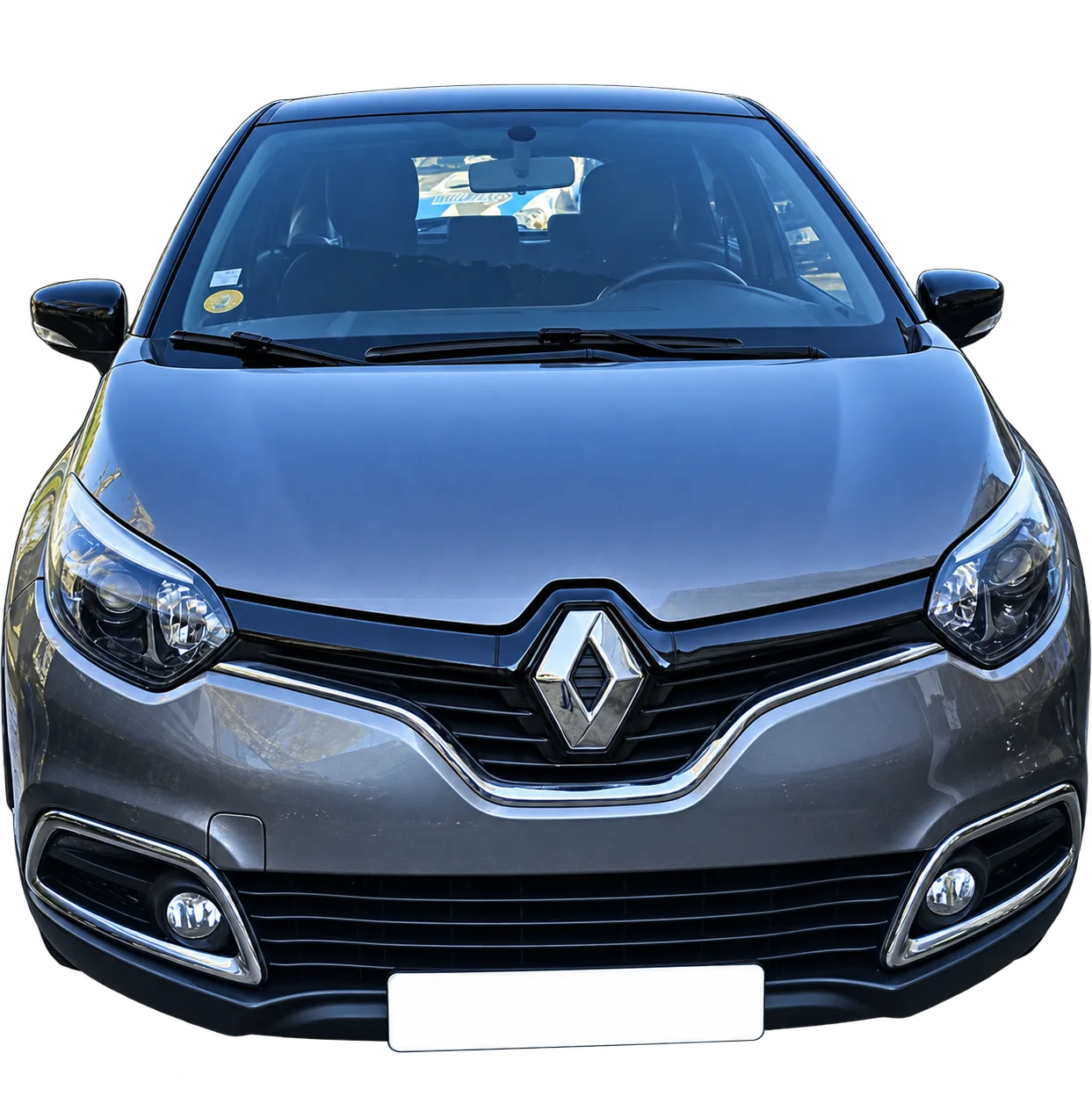 Face avant d’une Renault Captur grise avec son logo en losange.